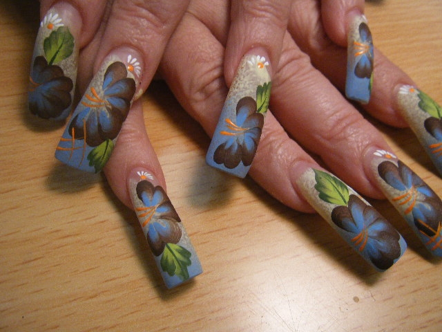 Exhibit Fine Floral Details on Large Nails