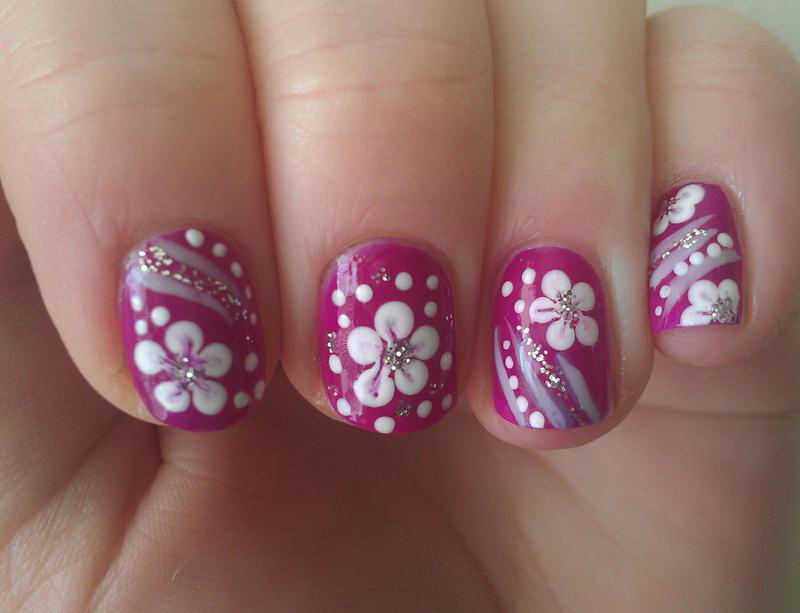 White Flower on Pink Nail